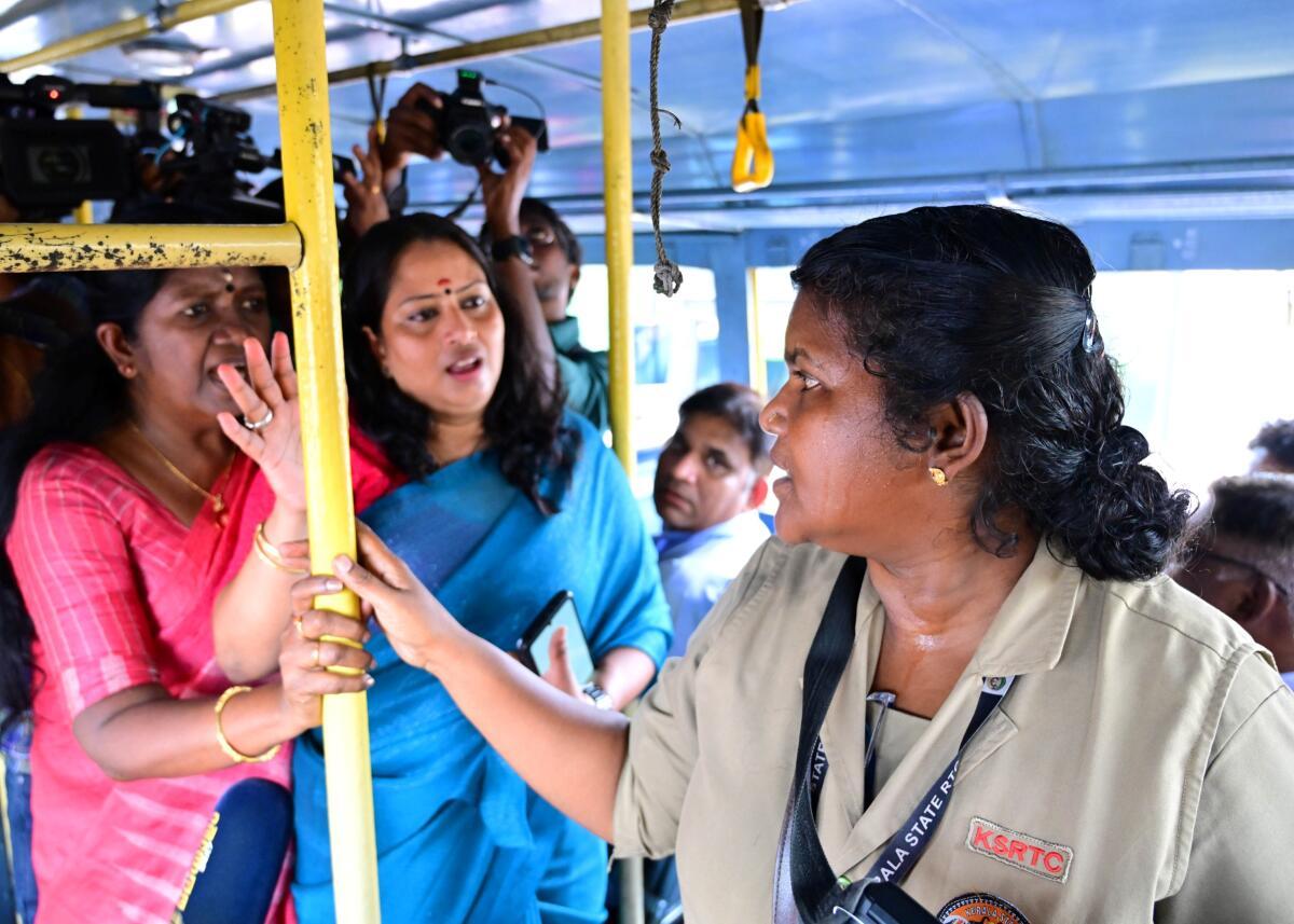 Mahila Morcha activists confront a KSRTC conductor during a protest at the Kottayam KSRTC bus station, demanding that free travel for women be extended to all categories of KSRTC buses.